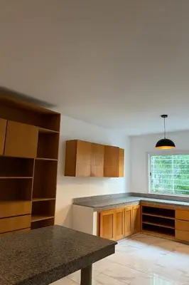 a kitchen with wooden cabinets and a counter top at Villa front mer in Rabat