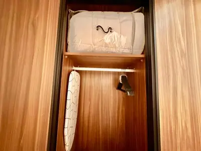 a wooden door with a suitcase on top of it at Cozy & Central with Terrace, Parking and Fiber Wifi in Casablanca