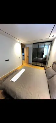 a bedroom with a large bed and a couch at Apartment in Maarif in Maarif