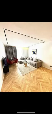 a living room with a couch and a table at Apartment in Maarif in Maarif