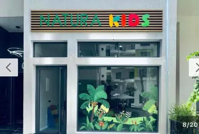 a restaurant with a sign on the front of it at Appartement haut standing piscine et fitness in Mohammedia