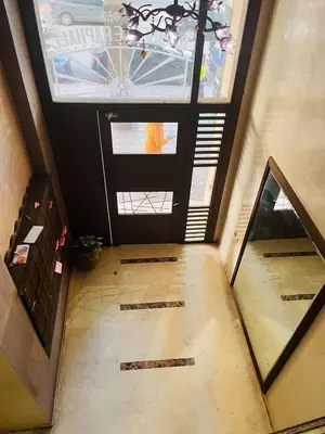 an empty hallway with a door and a window at 2 bedroom apartment with breakfast included in Casablanca