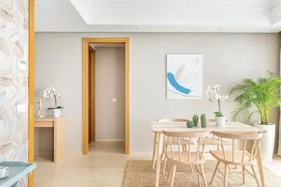 a dining room with a table and chairs at CFC, cozy 2 bedrooms apartment living room in Casablanca