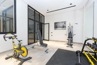 a gym with two treadmills and two exercise bikes at Premium Studio H&M - Near CFC and Anfa Park in Casablanca