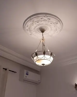 a chandelier hanging from a ceiling in a room at Downtown Casablanca Living Terrace & Tram Access in Casablanca