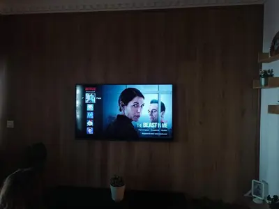 a flat screen tv sitting on a wall at Face à la Gare et au Tramway Moderne, Calme avec Resto sur place possible in Casablanca