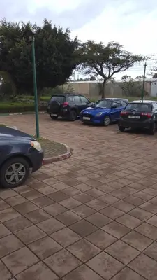 a group of cars parked in a parking lot at Hébergement de lux près stades in Rabat