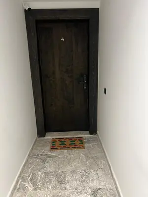 a door with a mat in front of it at Studio cosy avec patio privé -centre Rabat- Océan in Rabat