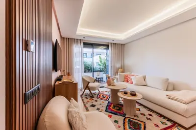 a living room with a couch and a table at Uptown Casa Anfa Luxury at Casa Finance City in Casablanca