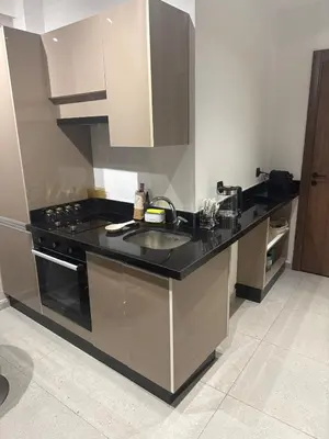 a kitchen with a sink and a stove at Studio Zen in Maarif
