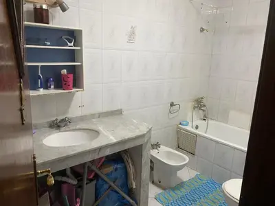 a bathroom with a sink and a toilet at Palace, Appartement Rabat Agdal in Rabat