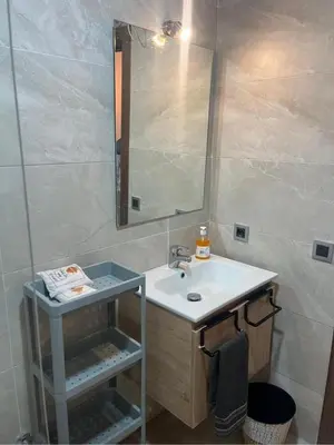 a bathroom with a sink and a mirror at residence cheickno firdaous casablanca in Settat