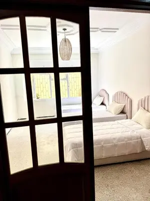 a door leading into a room with two beds at Luxury House in Rabat in Rabat