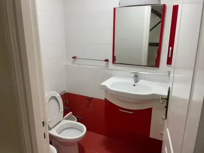 a bathroom with a toilet and a sink and a mirror at Casablanca Happy Homestay in Casablanca
