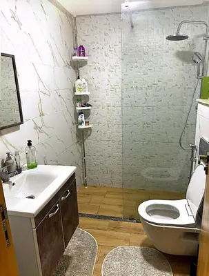 a bathroom with a toilet and a sink and a shower at Host By Med in Casablanca