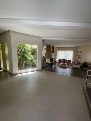 a large living room with a large window in a building at Villa Prestige avec piscine in Tamaris