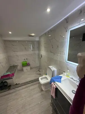 a bathroom with a toilet and a sink and a mirror at Saad's villa in Mohammedia