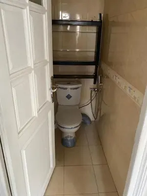 a bathroom with a toilet in a small room at pretty apparently in Casablanca