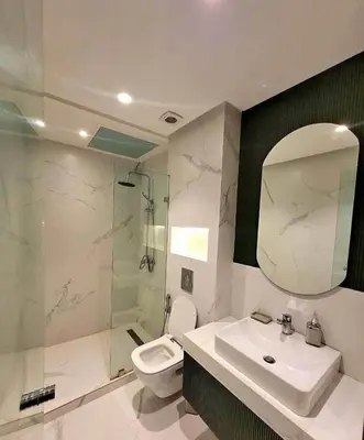 a bathroom with a sink and a toilet and a mirror at Apparemment errahma vile in Casablanca