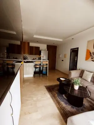 a living room with a couch and a table at New Cozy Studio In the Cornish of Casablanca in Casablanca