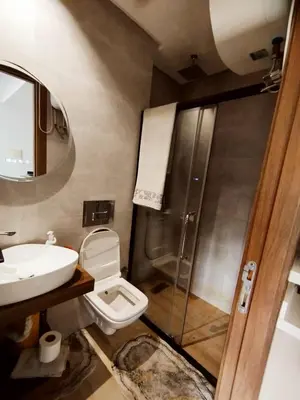 a bathroom with a shower and a toilet and a sink at New Cozy Studio In the Cornish of Casablanca in Casablanca