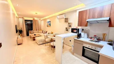 a kitchen and a living room with a kitchen and a living room at Cozy & Well-Equiped Studio - Valfleuri in Casablanca