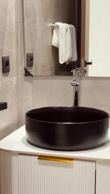 a black sink in a bathroom with a mirror at Cozy & Well-Equiped Studio - Valfleuri in Casablanca