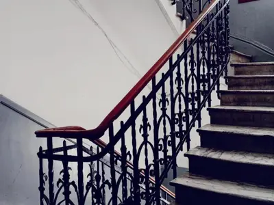 a chair sitting on the side of a staircase at Casablanca City Center Neoclassic Flat in Casablanca