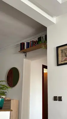 a living room with a shelf on the wall at The green stay in Rabat