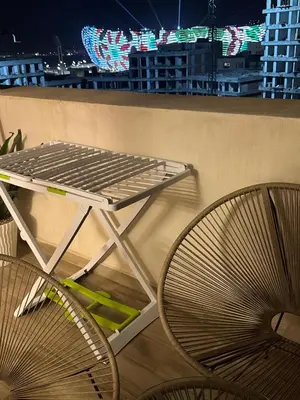 a table and two chairs sitting on a balcony at Murcia in Rabat