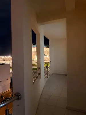 an empty hallway with a view of a city at night at Appartement avec vue sur monument emblématique Hassan II in Casablanca