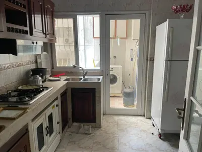 a kitchen with a sink and a refrigerator at Casablanca Happy B&B in Casablanca