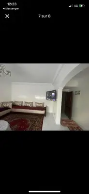 a living room with a couch and a tv at Amir 11 A in Casablanca