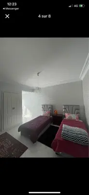 a bedroom with two beds in a room with at Amir 11 A in Casablanca