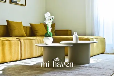 a living room with two tables and a couch at hamy - 1br - Downtown Casablanca in Casablanca