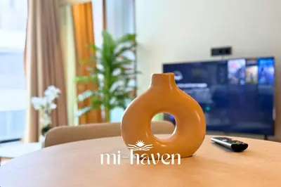 a small orange vase sitting on top of a table at hamy - 1br - Downtown Casablanca in Casablanca