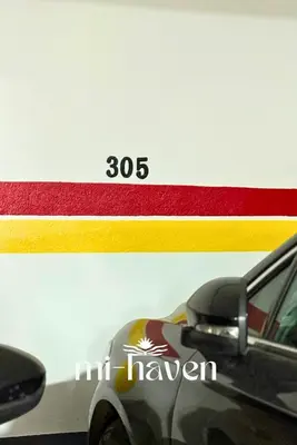 a picture of a car parked next to a race car at hamy - 1br - Downtown Casablanca in Casablanca
