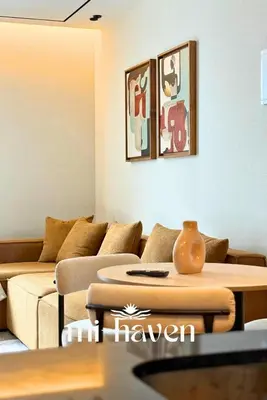 a living room with a couch and a table at hamy - 1br - Downtown Casablanca in Casablanca
