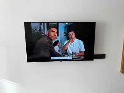 a flat screen tv with two men on it at Studio 14 in Casablanca