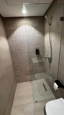 a bathroom with a shower with a glass door at Studio 14 in Casablanca