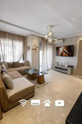 a living room with a couch and a table at Chic Cozy Studio Maarif Casablanca in Casablanca