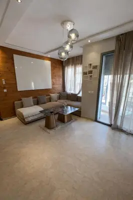 a living room with a couch and a table at Chic Cozy Studio Maarif Casablanca in Casablanca