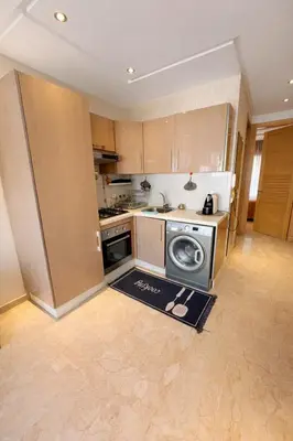 a kitchen with a stove and a dishwasher at Chic Cozy Studio Maarif Casablanca in Casablanca