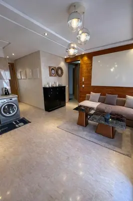 a large living room with a couch and a stove at Chic Cozy Studio Maarif Casablanca in Casablanca