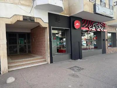 a store front with its doors open on a street at Fatine