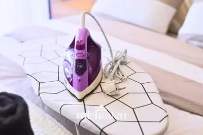 a remote control sitting on top of a table at Hamma - 1 BR - Premium condo in Casablanca