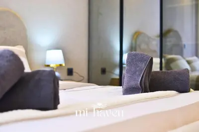 a hotel room with two beds with purple shoes on them at Hamma - 1 BR - Premium condo in Casablanca