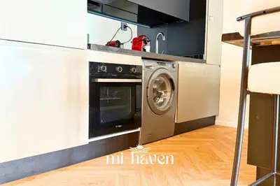 a kitchen with a washing machine in a kitchen at Hamma - 1 BR - Premium condo in Casablanca