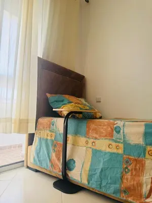 a bed in a room with a bed sidx sidx sidx at Appartement lumineux a belvedere in Casablanca