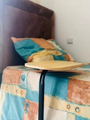 a surfboard is sitting on top of a bed at Appartement lumineux a belvedere in Casablanca